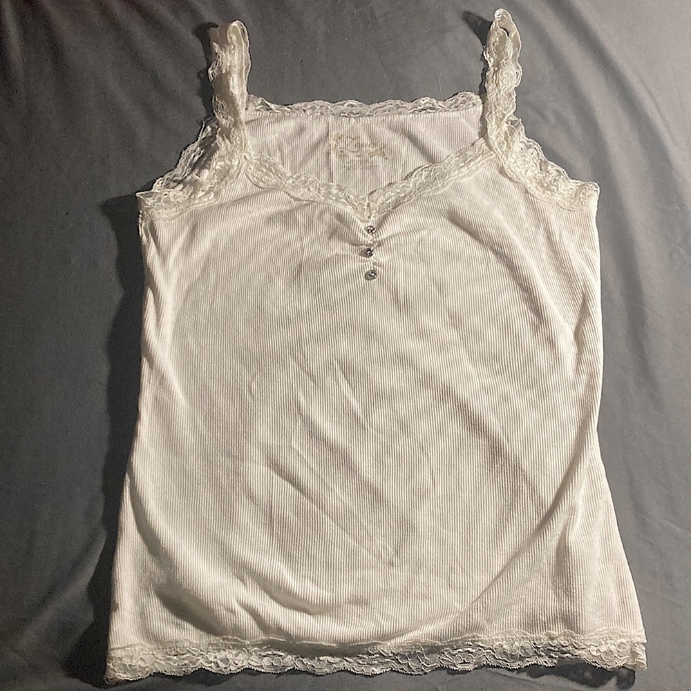 Medium lace white tank top with diamond buttons.